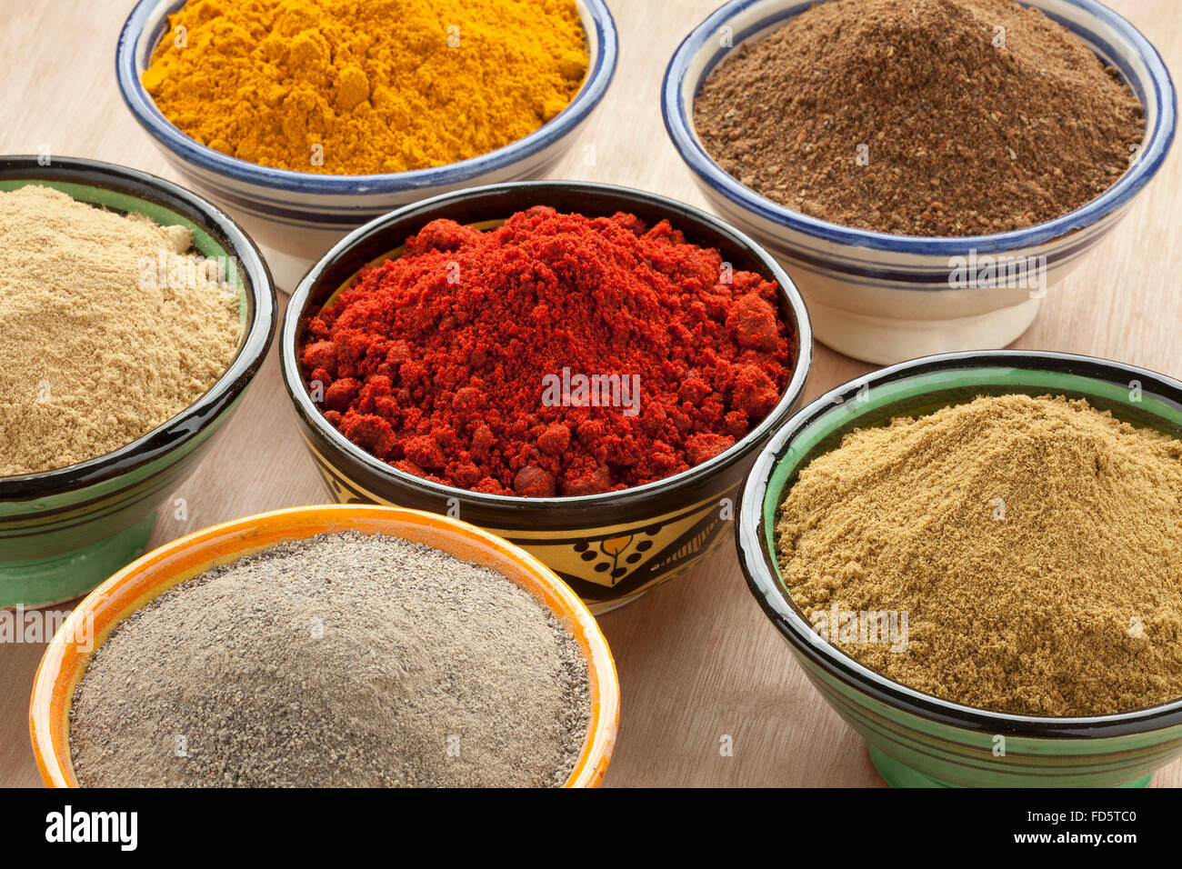 Moroccan bowls with different ground spices Stock Photo