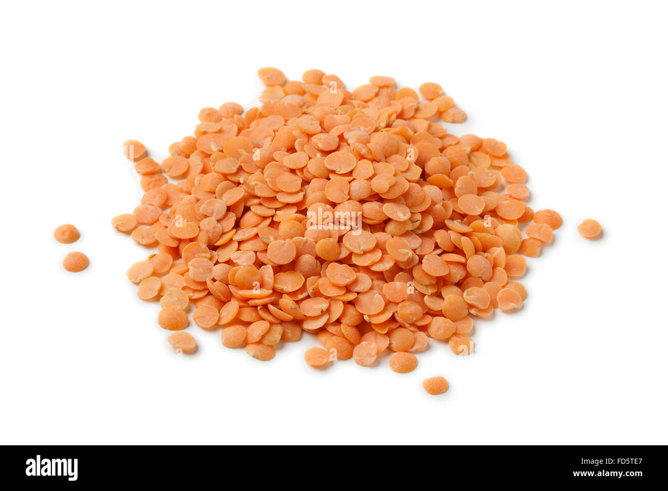 Heap of dried red lentils on white background Stock Photo