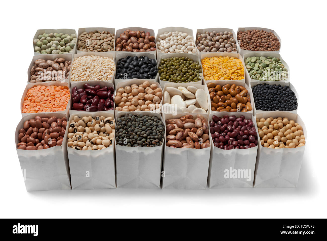 Variety of dried beans and lentils in bags on white background Stock Photo