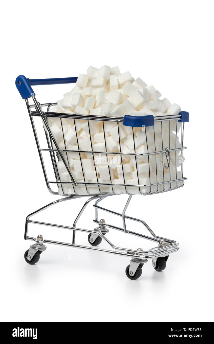 Shopping cart with sugar cubes on white background Stock Photo