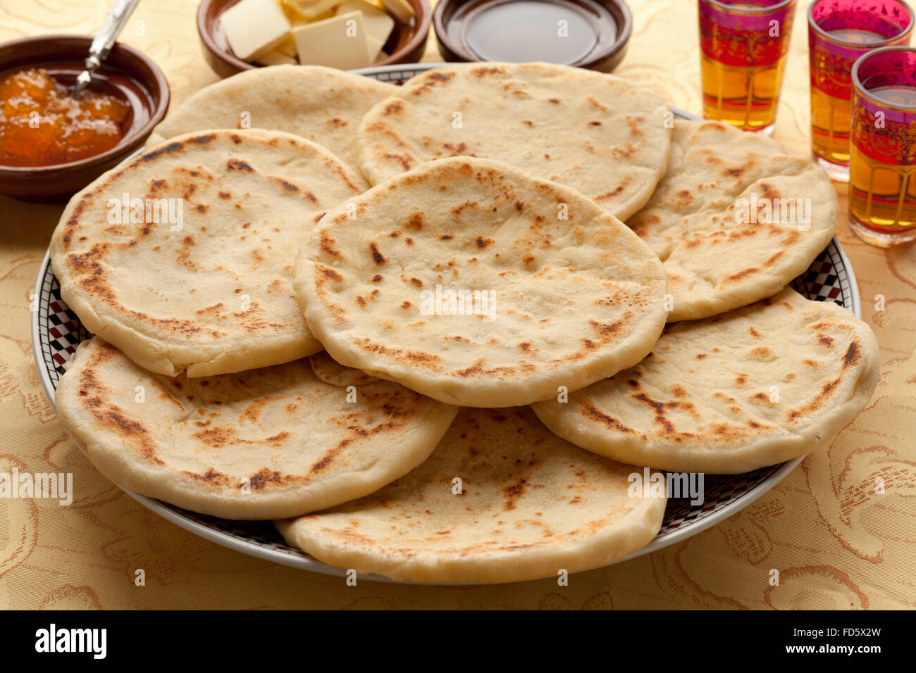 Traditional Moroccan batbot on a dish with jam butter and oil