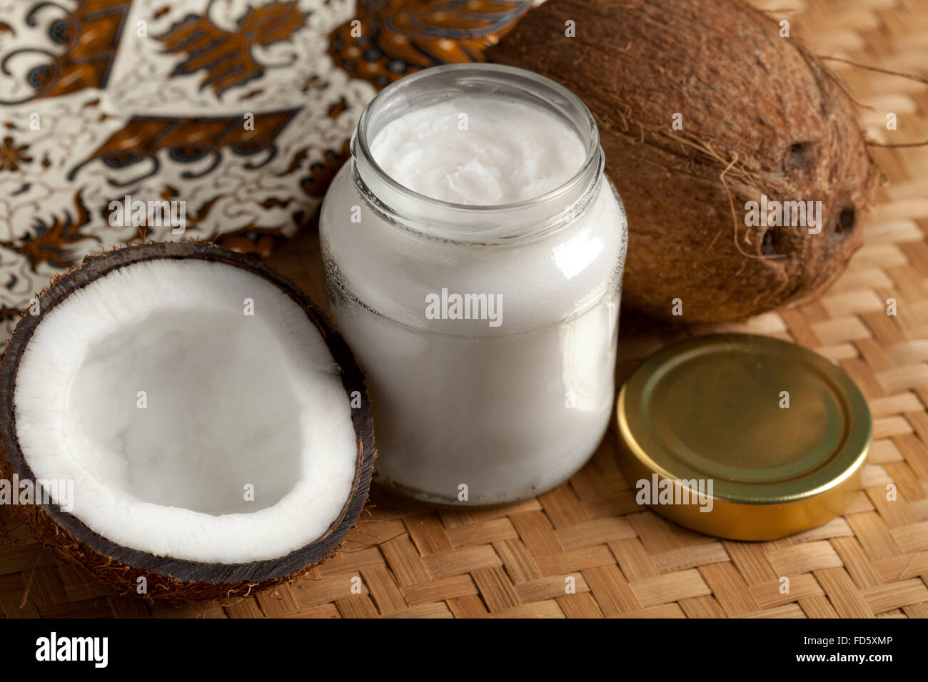 Coconut oil and fresh coconut Stock Photo