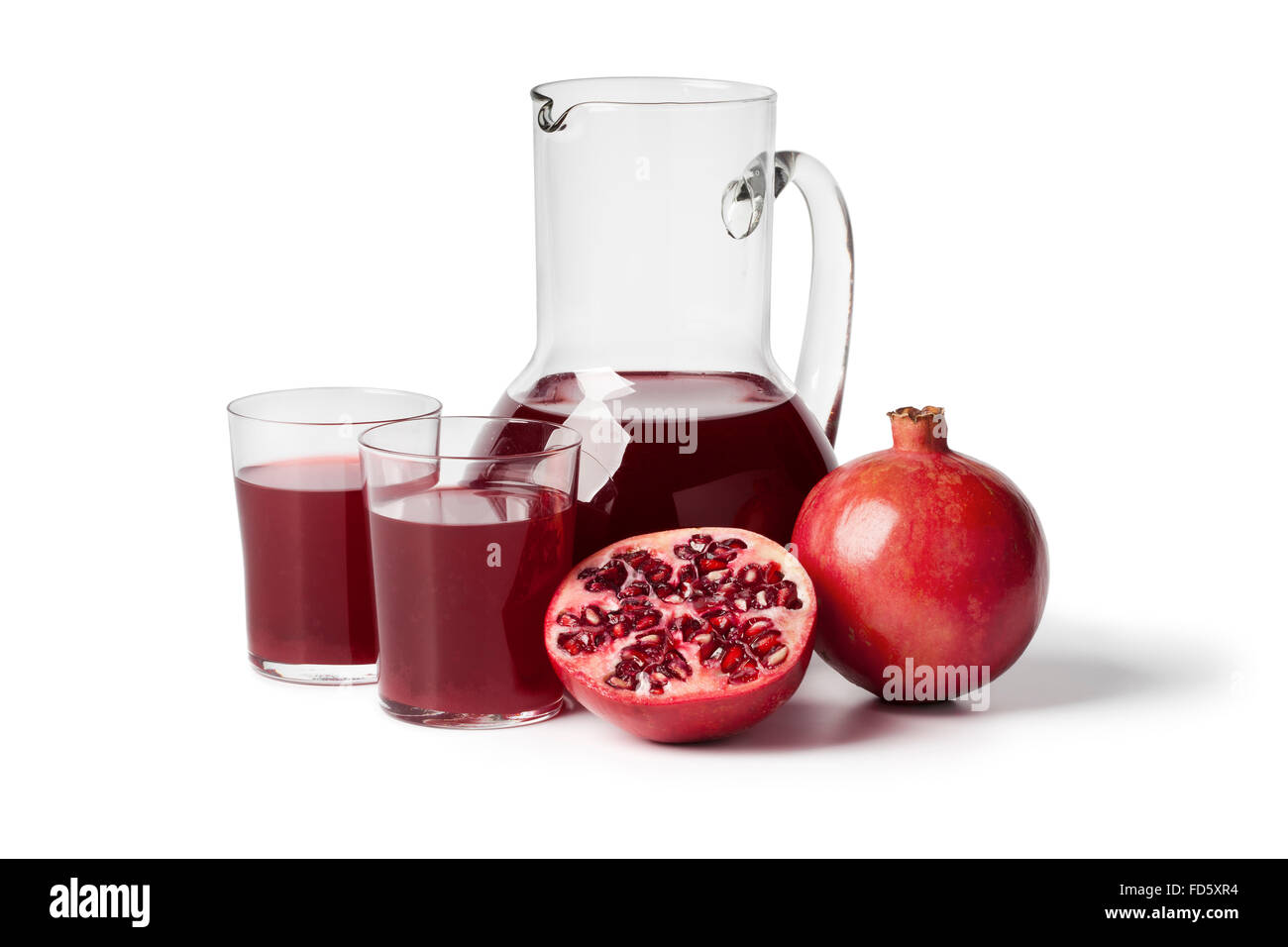 Fresh pomegranate juice in a jar on white background Stock Photo