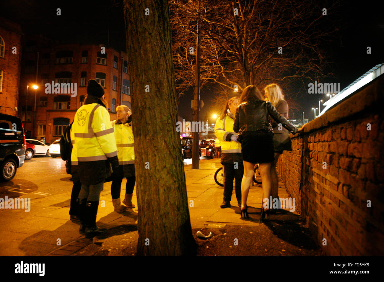 Deansgate lock Members of the manchester street angels. help two young