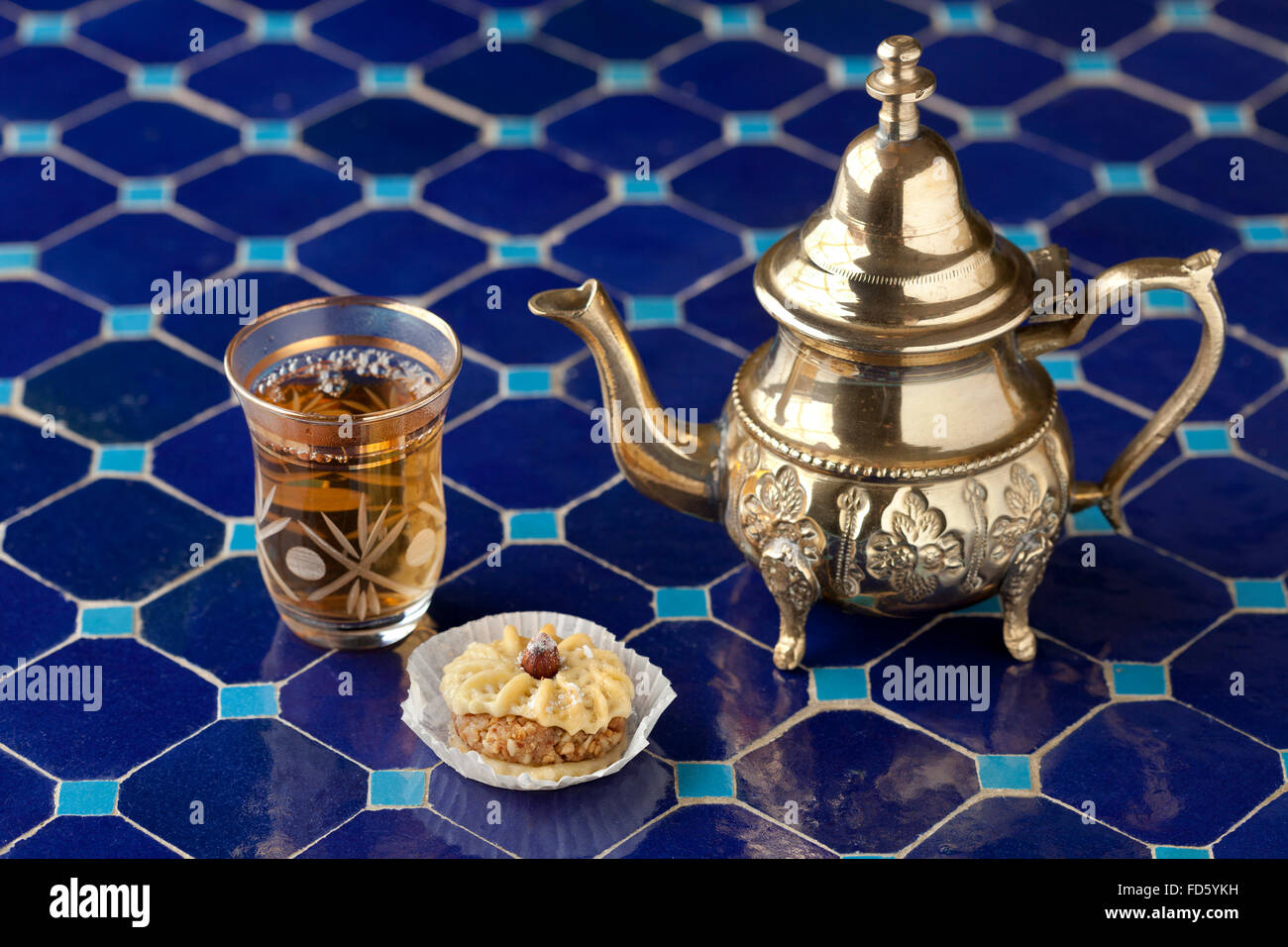 Traditional Moroccan tea and cookie on a mosaic table Stock Photo