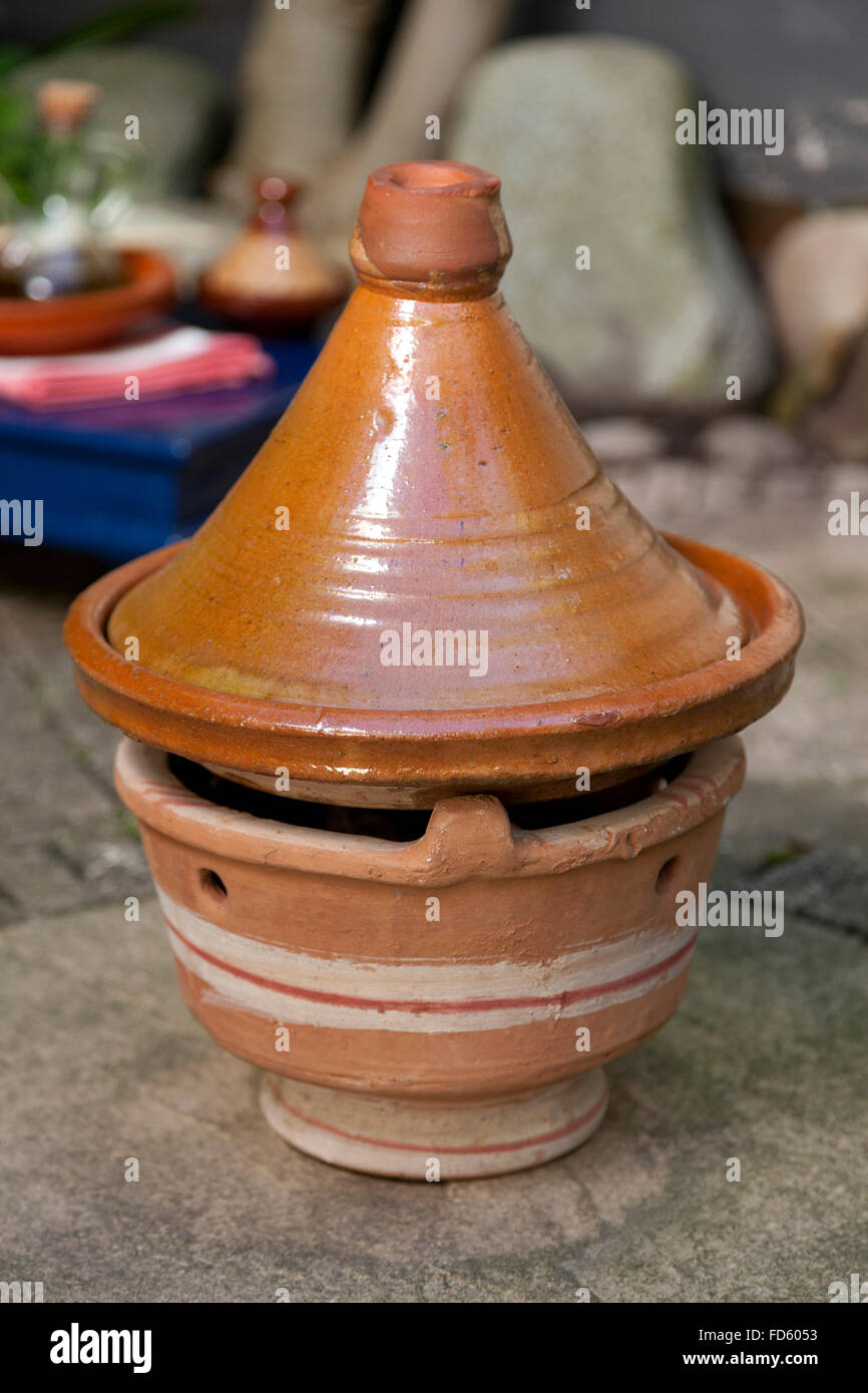 Moroccan stove with tajine in the garden Stock Photo