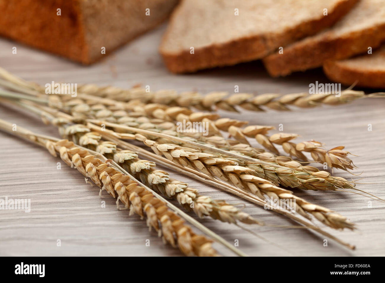 Dried spelt close up with peasant bread Stock Photo
