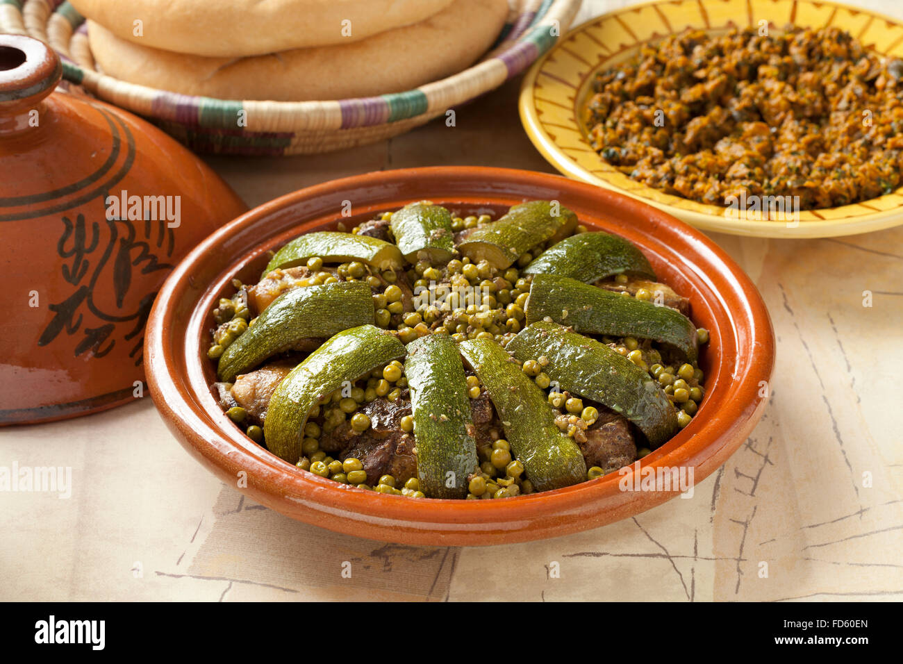 Traditional Moroccan dish with lamb, peas and courgette close up Stock Photo
