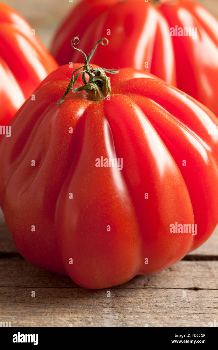 Whole fresh Coeur de Boeuf Tomatoes Stock Photo