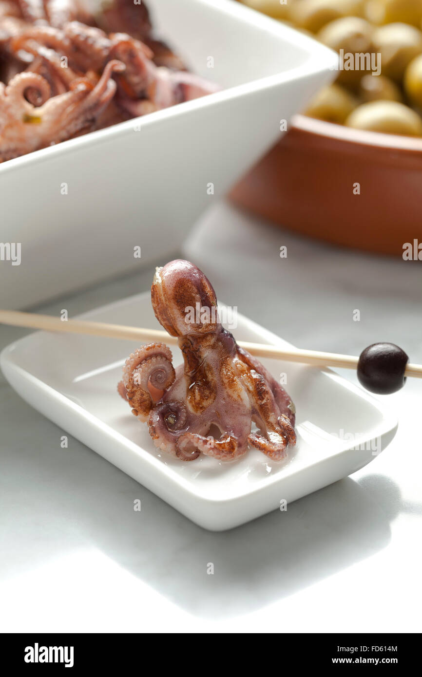 Pickled small baby octopus as tapas Stock Photo