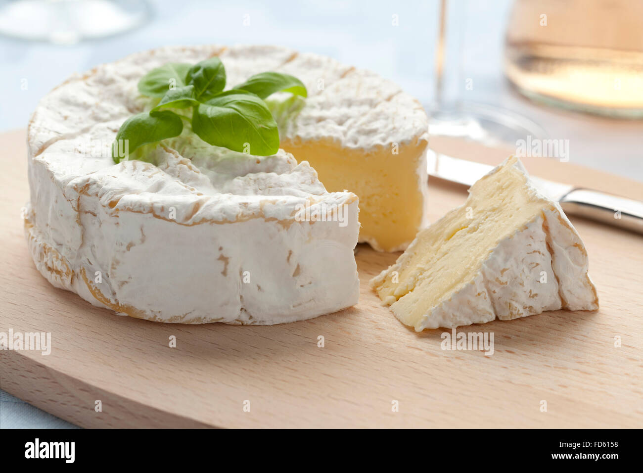 Fresh French Camembert cheese and a slice Stock Photo