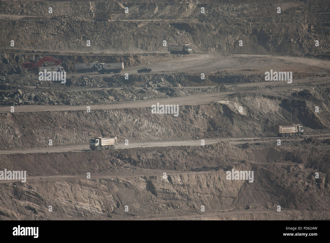 Trucks At Layers Of Opencast Mine Stock Photo