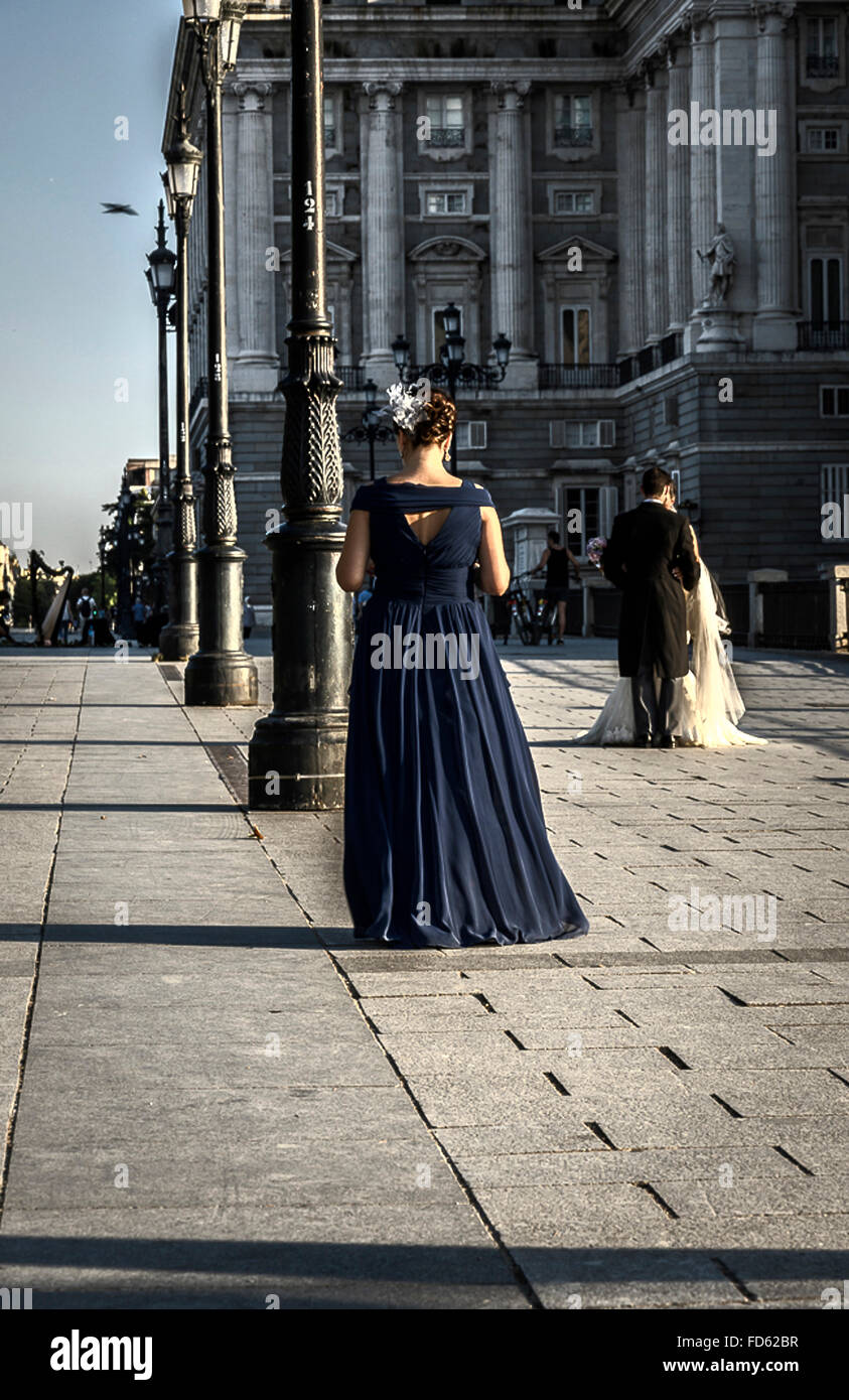 A woman celebrating a wedding with a blue dress in Madrid city Stock