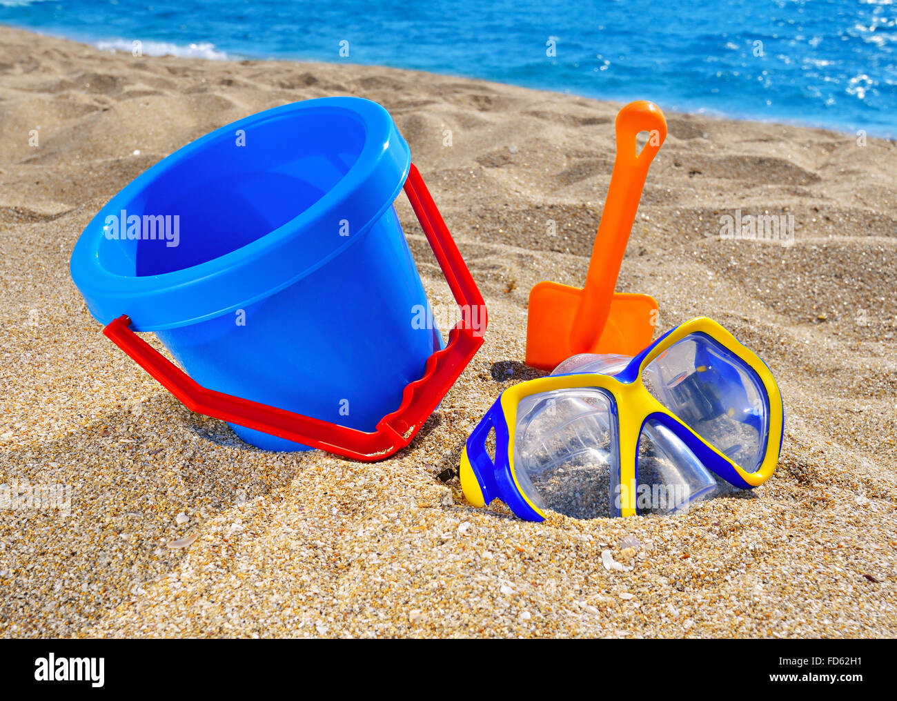 Baby beach toys on the sand against the blue sea Stock Photo Alamy