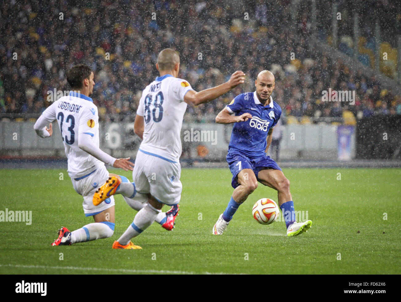KYIV, UKRAINE - MAY 14, 2015: Jaba Kankava of FC Dnipro (R) fights for a ball with Manolo Gabbiadini (L) and Gokhan Inler of SSC Napoli during their UEFA Europa League semifinal game Stock Photo