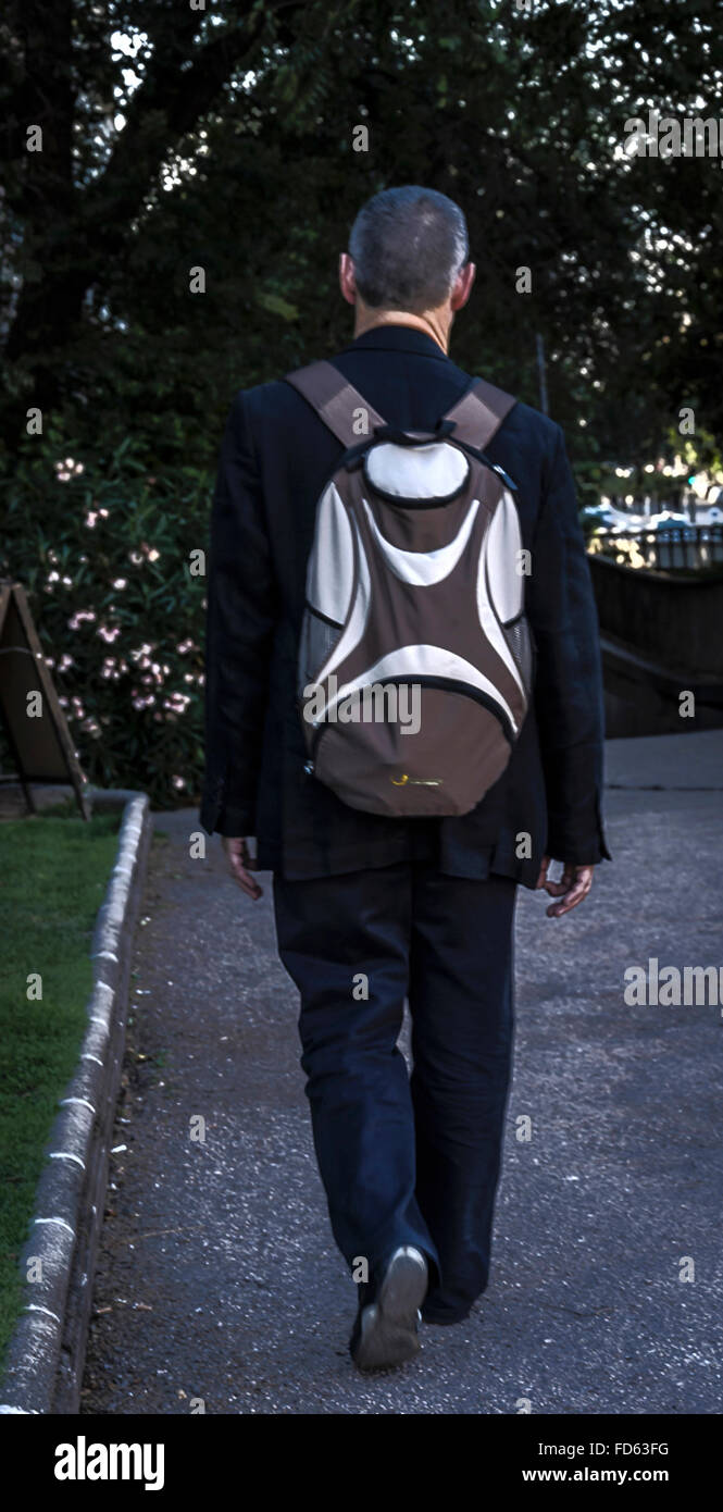 Walk With Rucksack A man walking in a park with a rucksack Stock Photo - Alamy