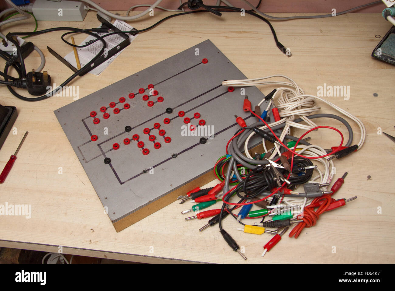 A patch board for assembling electrical components to test a loudspeaker crossover. Stock Photo