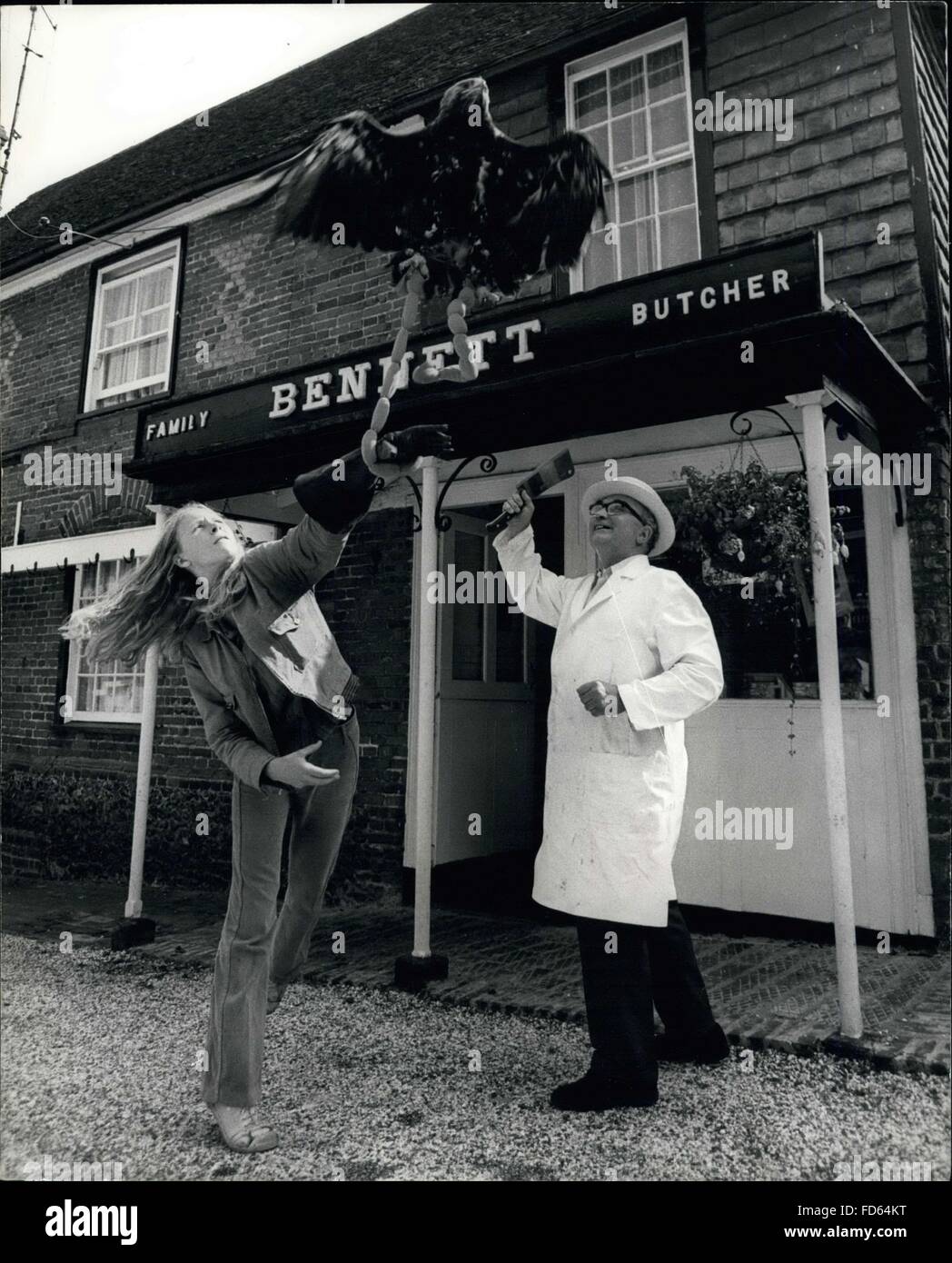1962 - stop that eagle: Bugsy, the imperial eagle from chilham castle, Kent, certainly knows what he likes when he goes out shopping with Linda Poole. one of the assistant falconers from the castle. The price of bangers (sausages) is continuing to rise but never so fast as when Bugay's eagle eye spotted them in the shop of the local butcher, Mr. Bennett. © Keystone Pictures USA/ZUMAPRESS.com/Alamy Live News Stock Photo