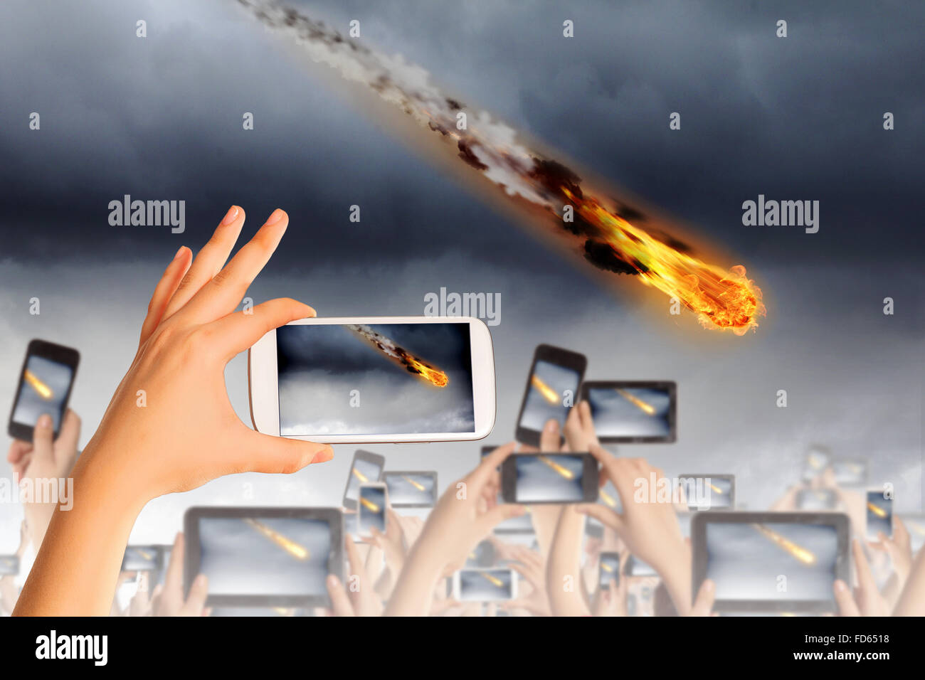 People taking photos of falling meteorite on mobile phone camera Stock ...
