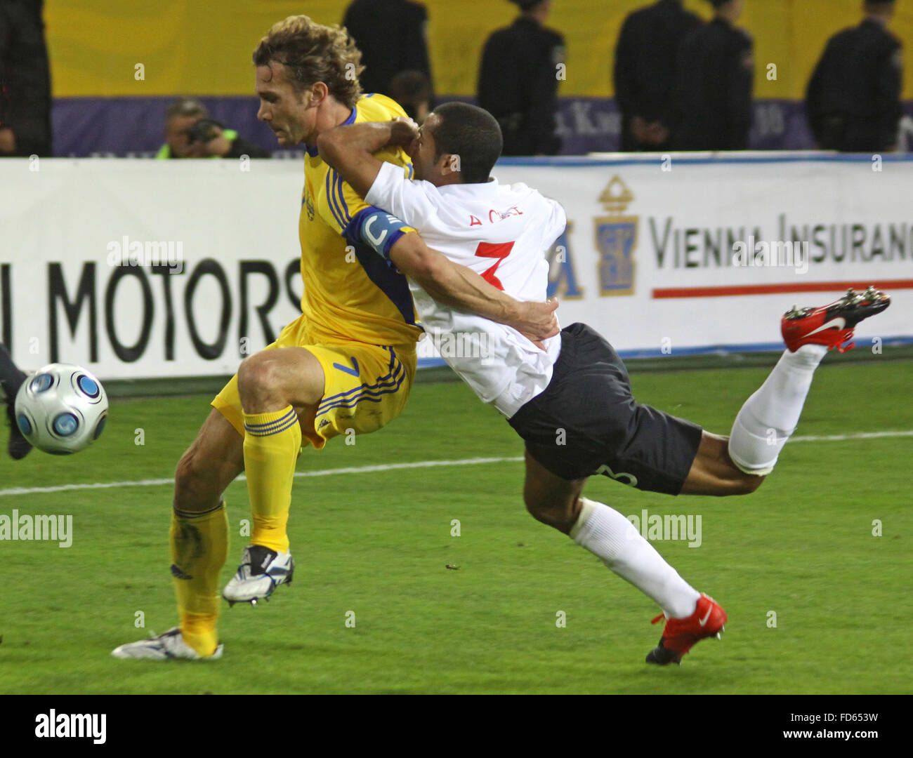 DNIPROPETROVSK, UKRAINE - OCTOBER 10: Andriy Shevchenko (L) of Ukraine fights for a ball with Ashley Cole (R) of England during the WC2010 Group 6 qualifying football match at the Dnipro Arena on October 10, 2009 in Dnepropetrovsk. Ukraine won 1-0 Stock Photo