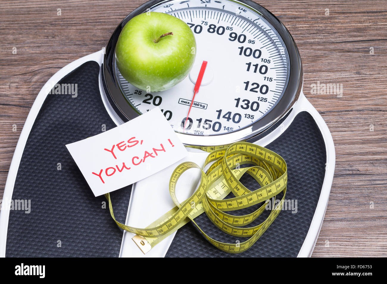 Lose weight concept. Bathroom scale, measuring tape, apples on