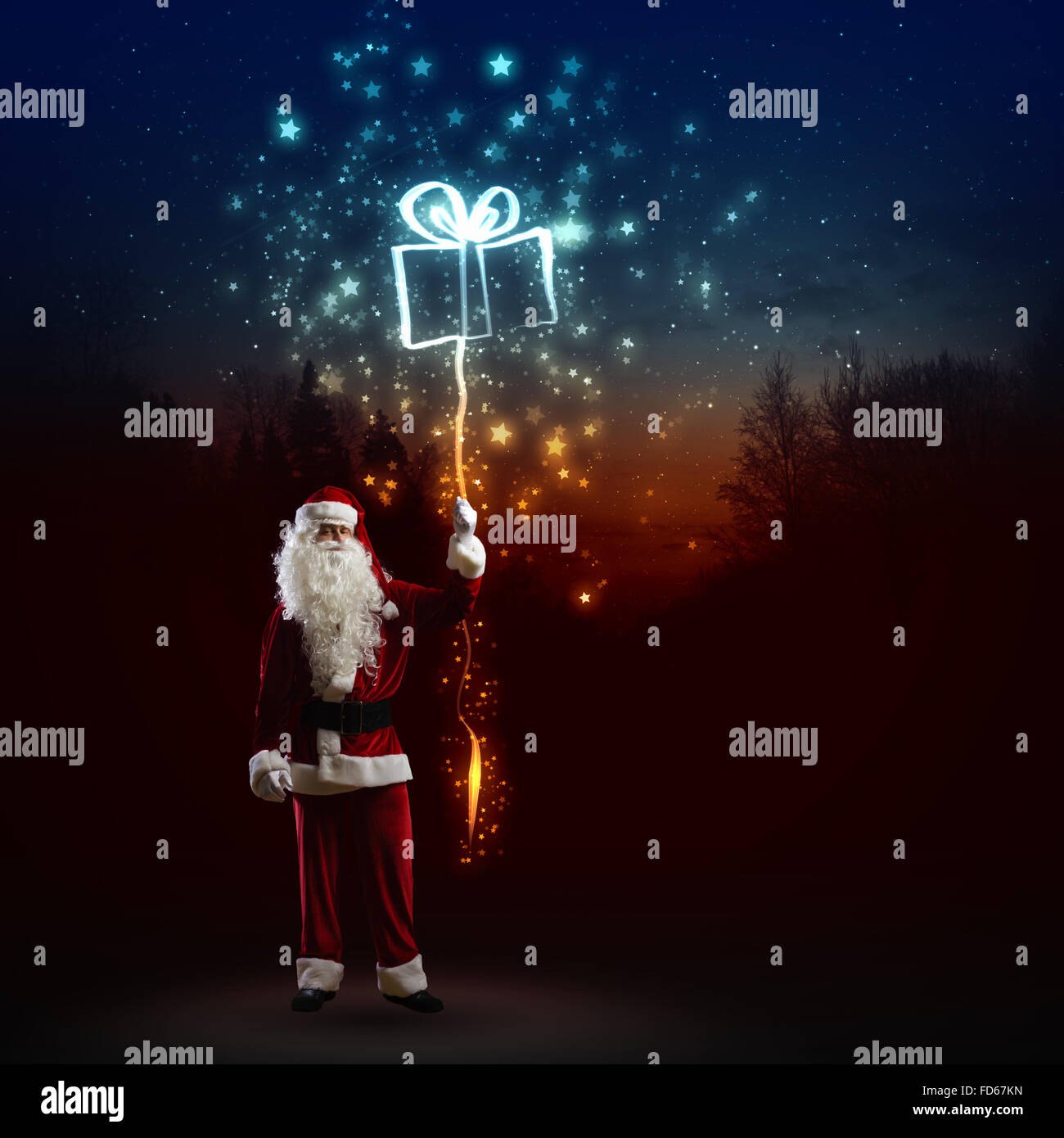 Image of Santa Claus with present against dark background Stock Photo ...