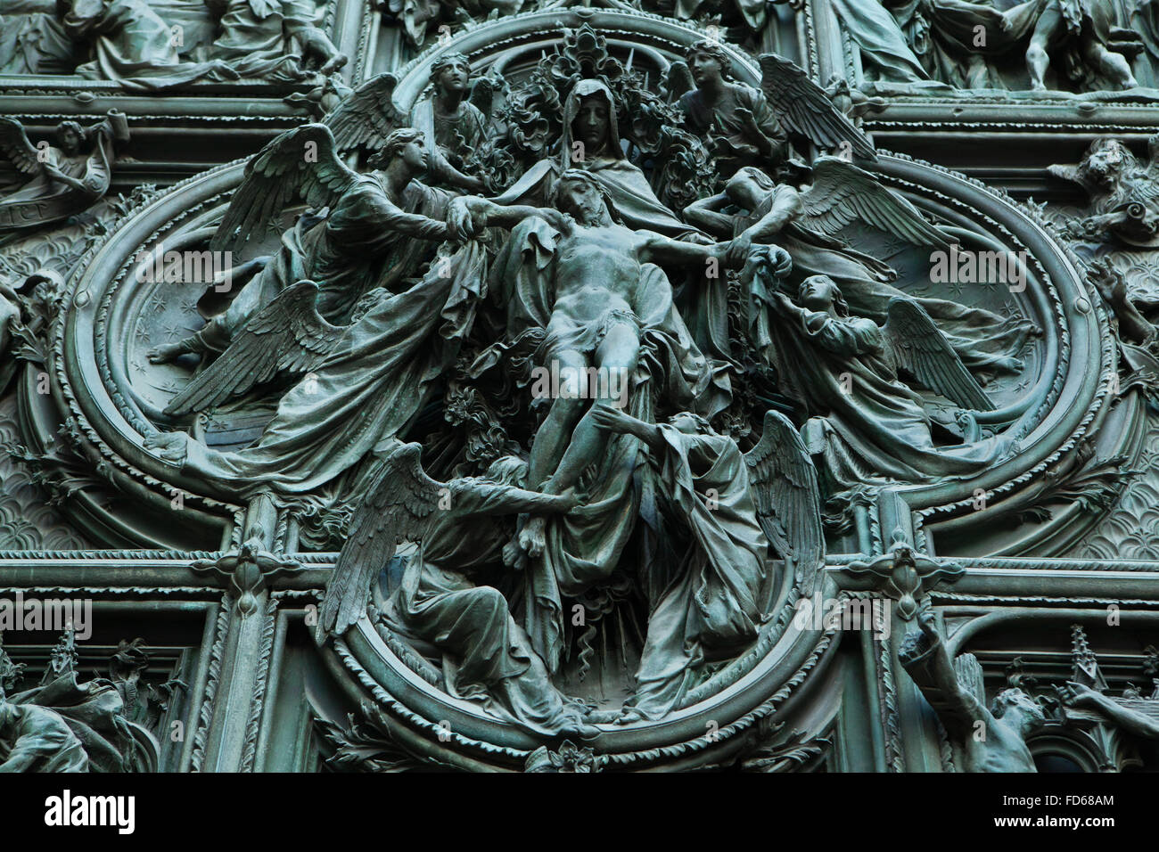Ascension of Jesus. Detail of the main bronze door of the Milan Cathedral (Duomo di Milano) in Milan, Italy. The bronze door was designed by Italian sculptor Ludovico Pogliaghi in 1894-1908. Stock Photo