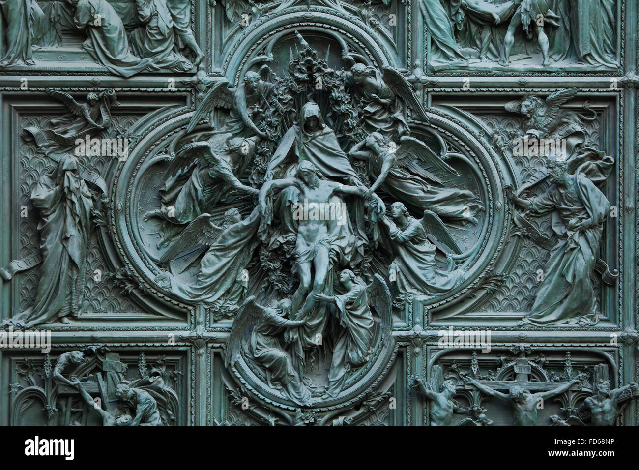 Ascension of Jesus. Detail of the main bronze door of the Milan Cathedral (Duomo di Milano) in Milan, Italy. Evangelists Saint Matthew and Saint Mark are depicted on each side. The bronze door was designed by Italian sculptor Ludovico Pogliaghi in 1894-1908. Stock Photo