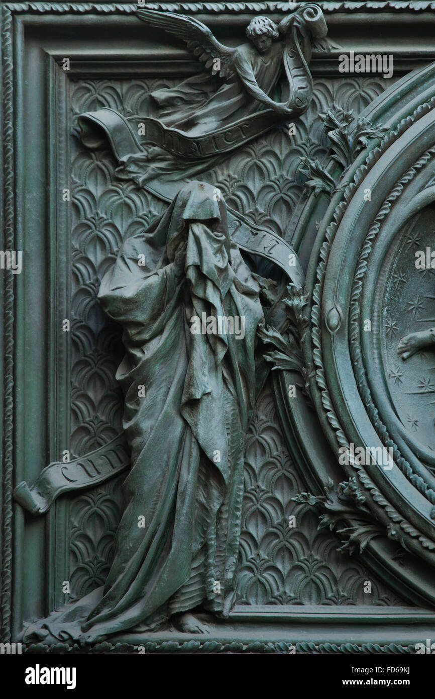 Saint Matthew the Evangelist. Detail of the main bronze door of the Milan Cathedral (Duomo di Milano) in Milan, Italy. The bronze door was designed by Italian sculptor Ludovico Pogliaghi in 1894-1908. Stock Photo