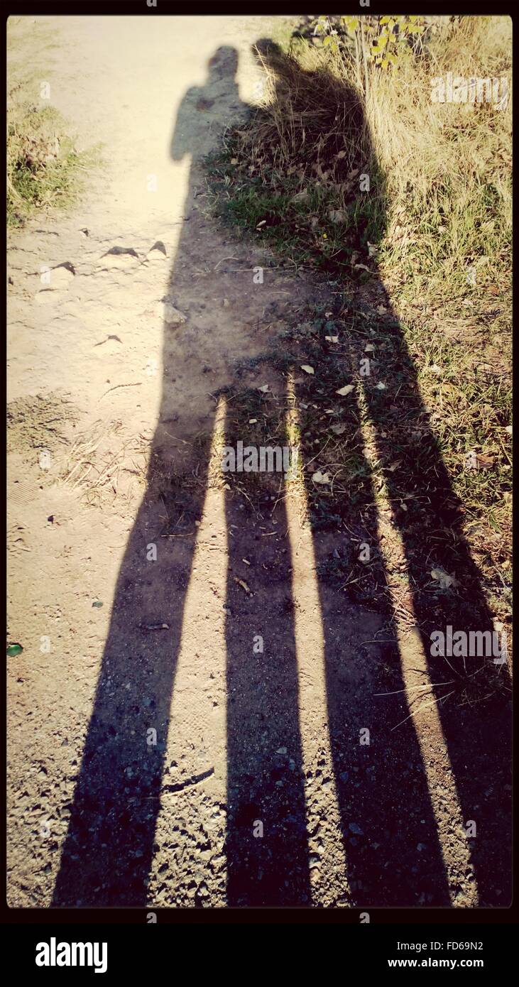 Shadow Of People On Land Stock Photo