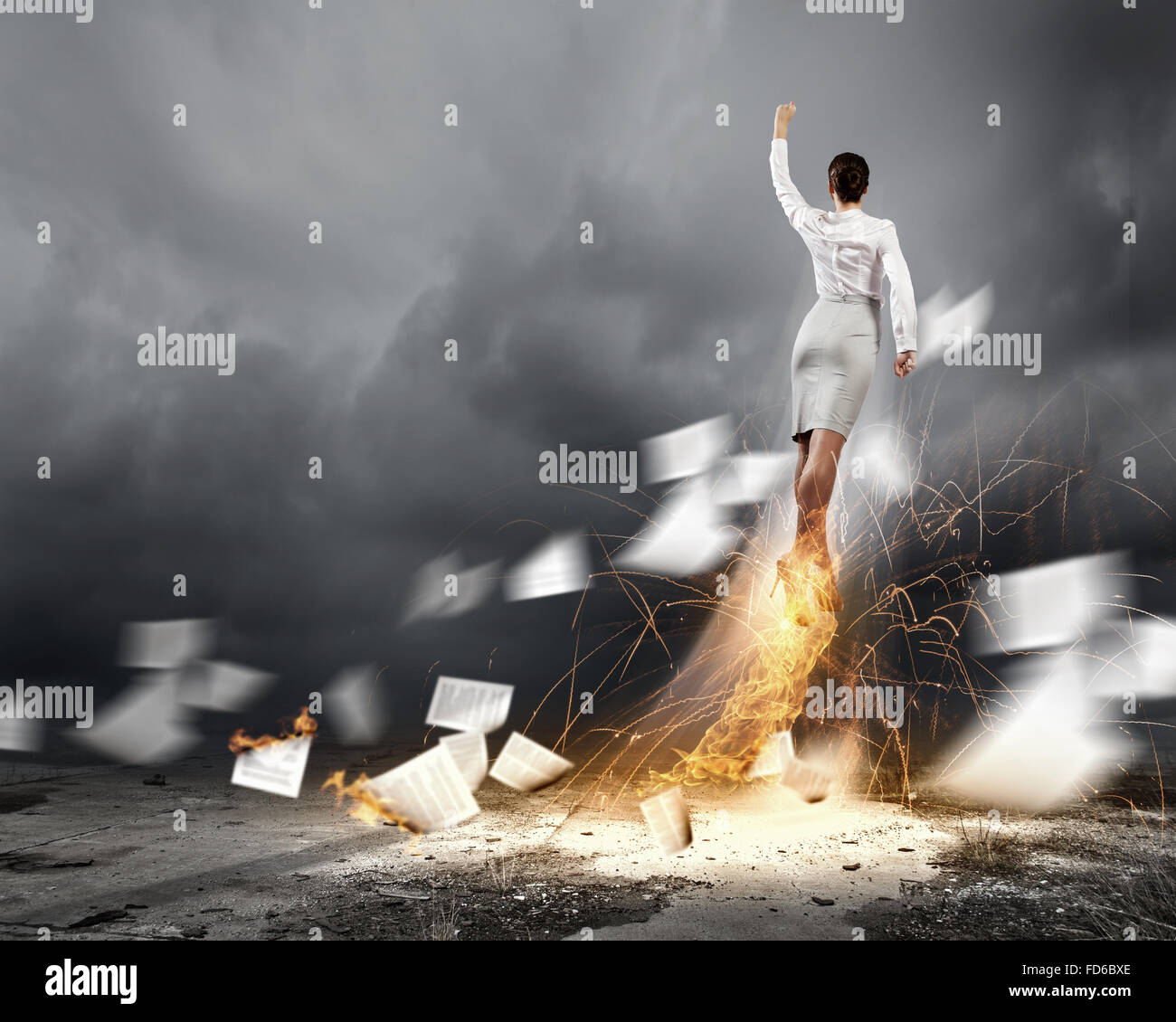 Image of businesswoman flying up into sky Stock Photo - Alamy