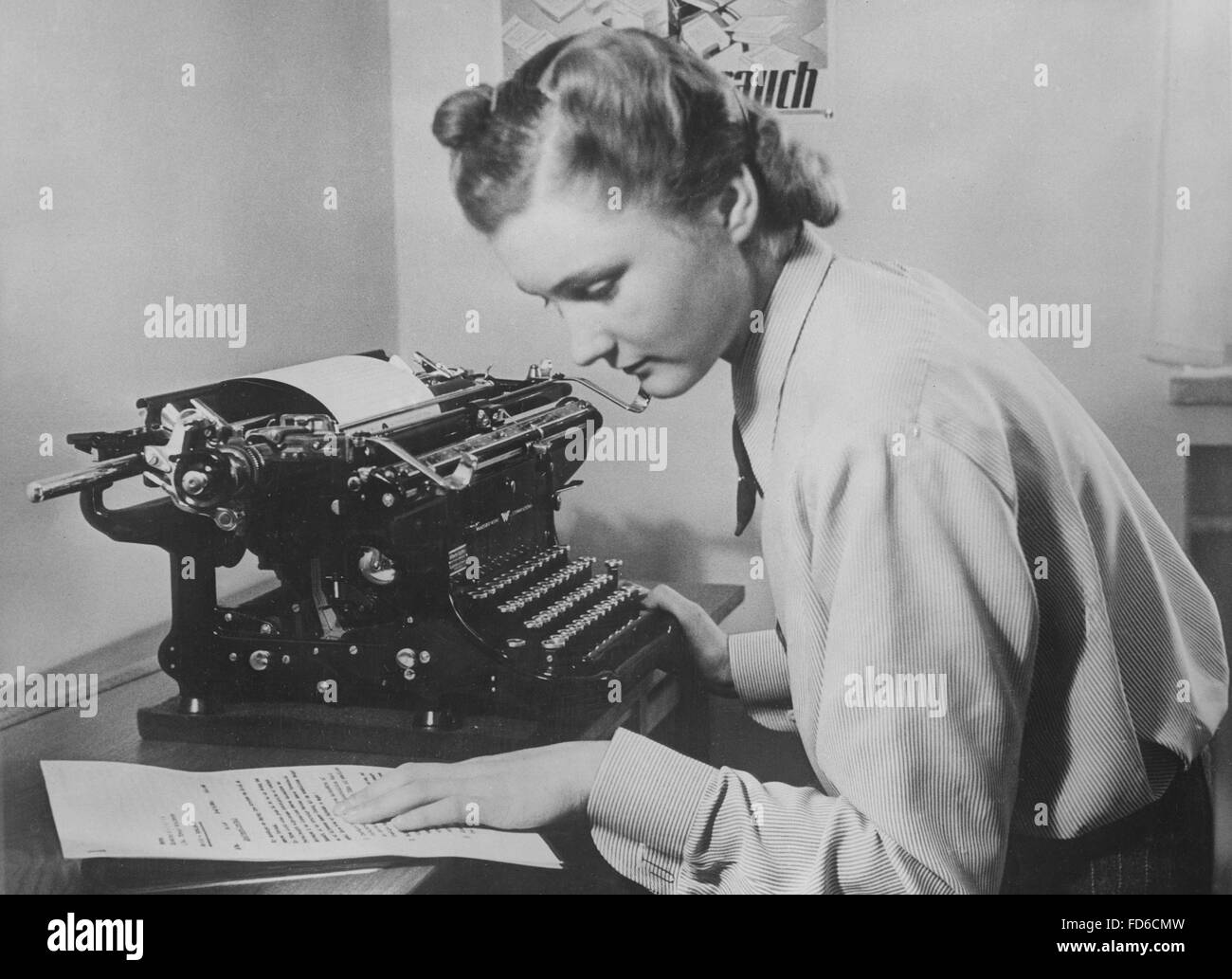 Secretary with typewriter, before 1945 Stock Photo