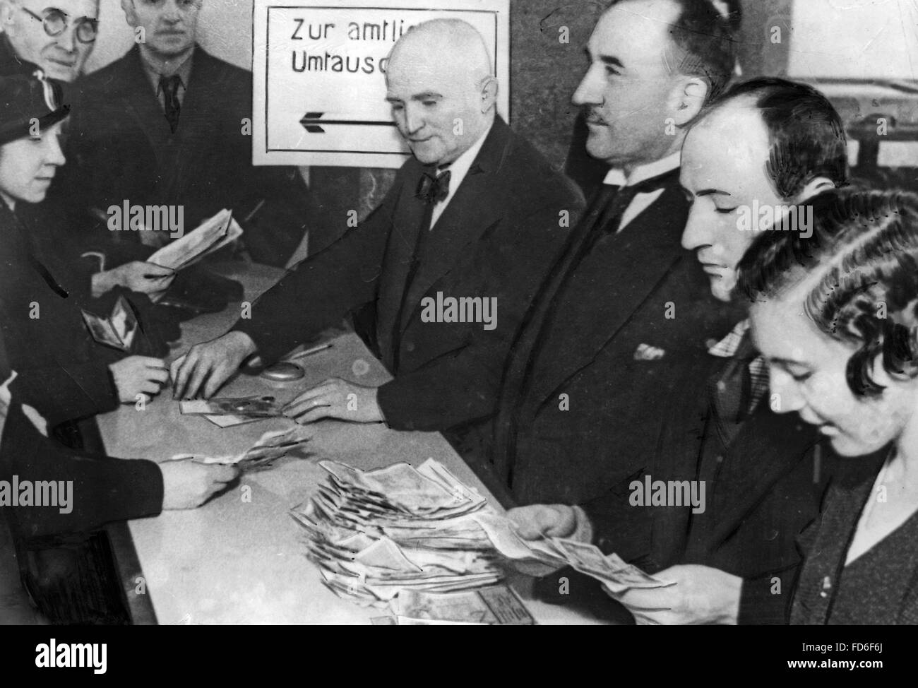 Inhabitants of the Saarland change their French money for German Reichsmark, 1935 Stock Photo