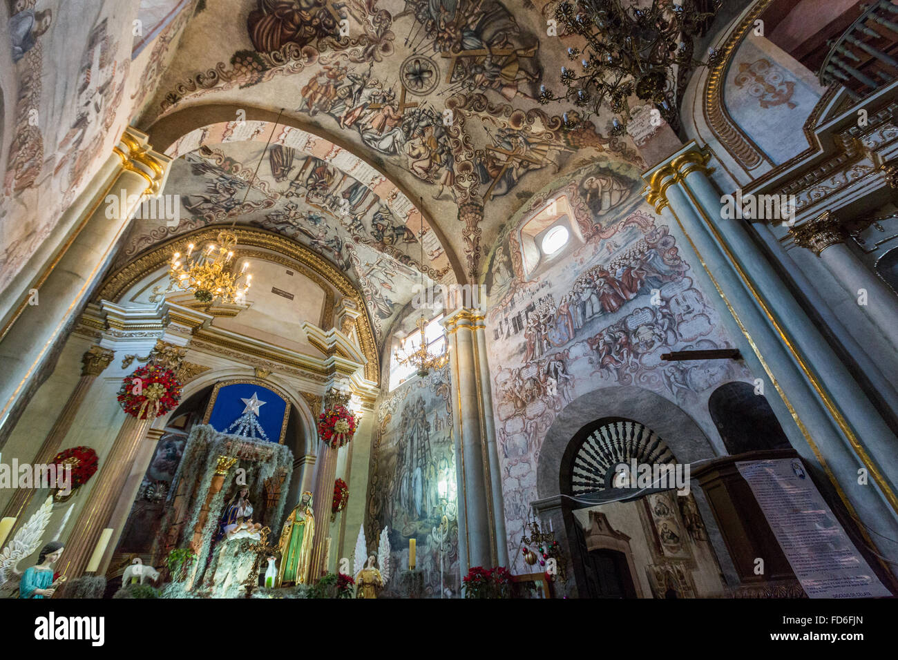 Mexican folk Baroque murals painted on the ceiling and walls at the ...