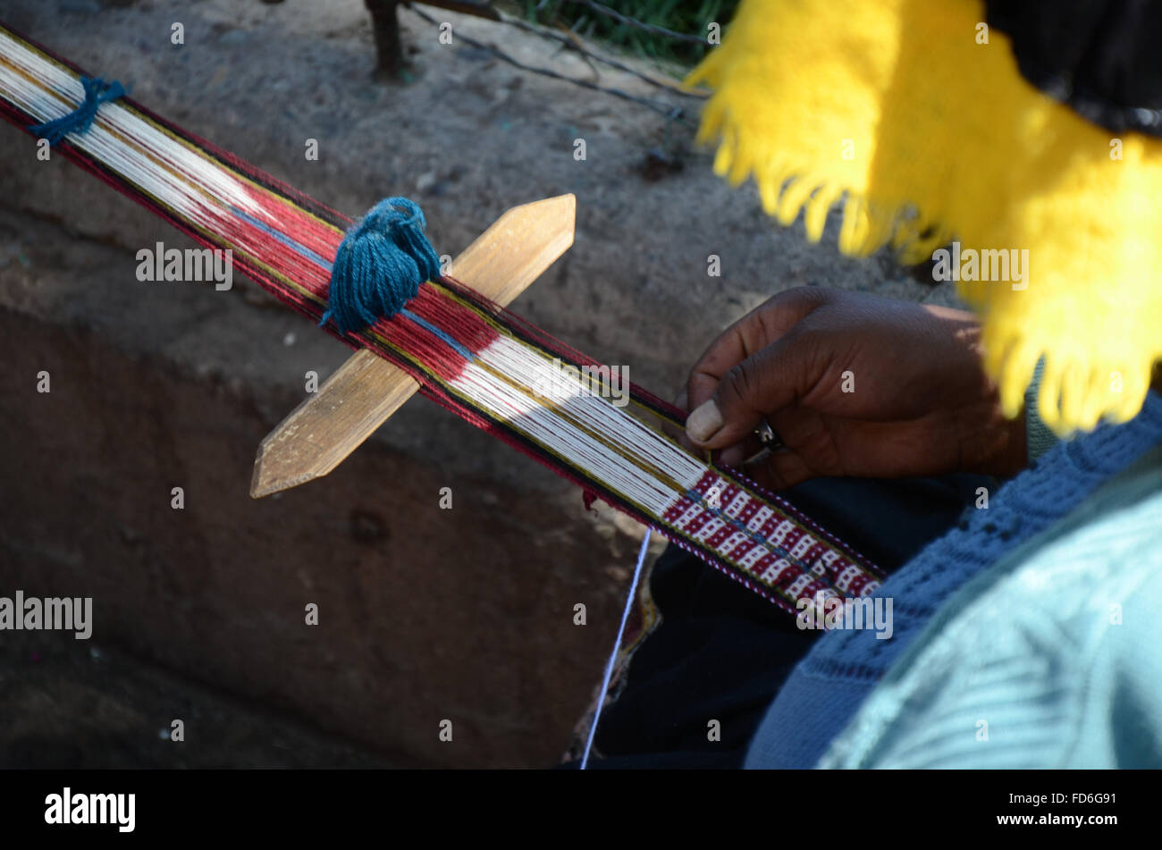 Close-Up Of Cropped Man Weaving Stock Photo