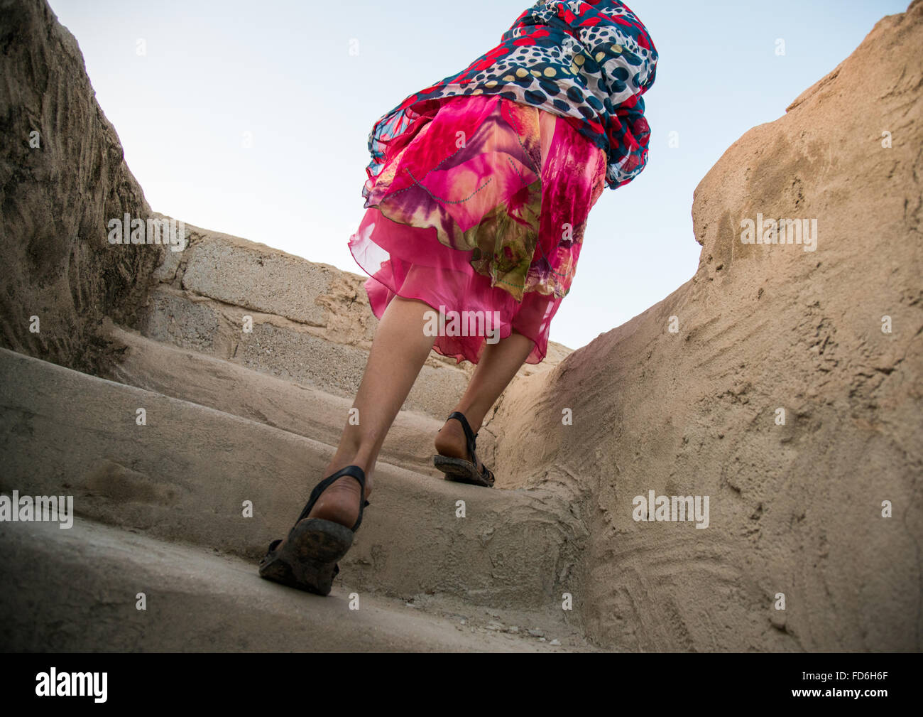girl climbing stairs, Hormozgan, Kushkenar, Iran Stock Photo
