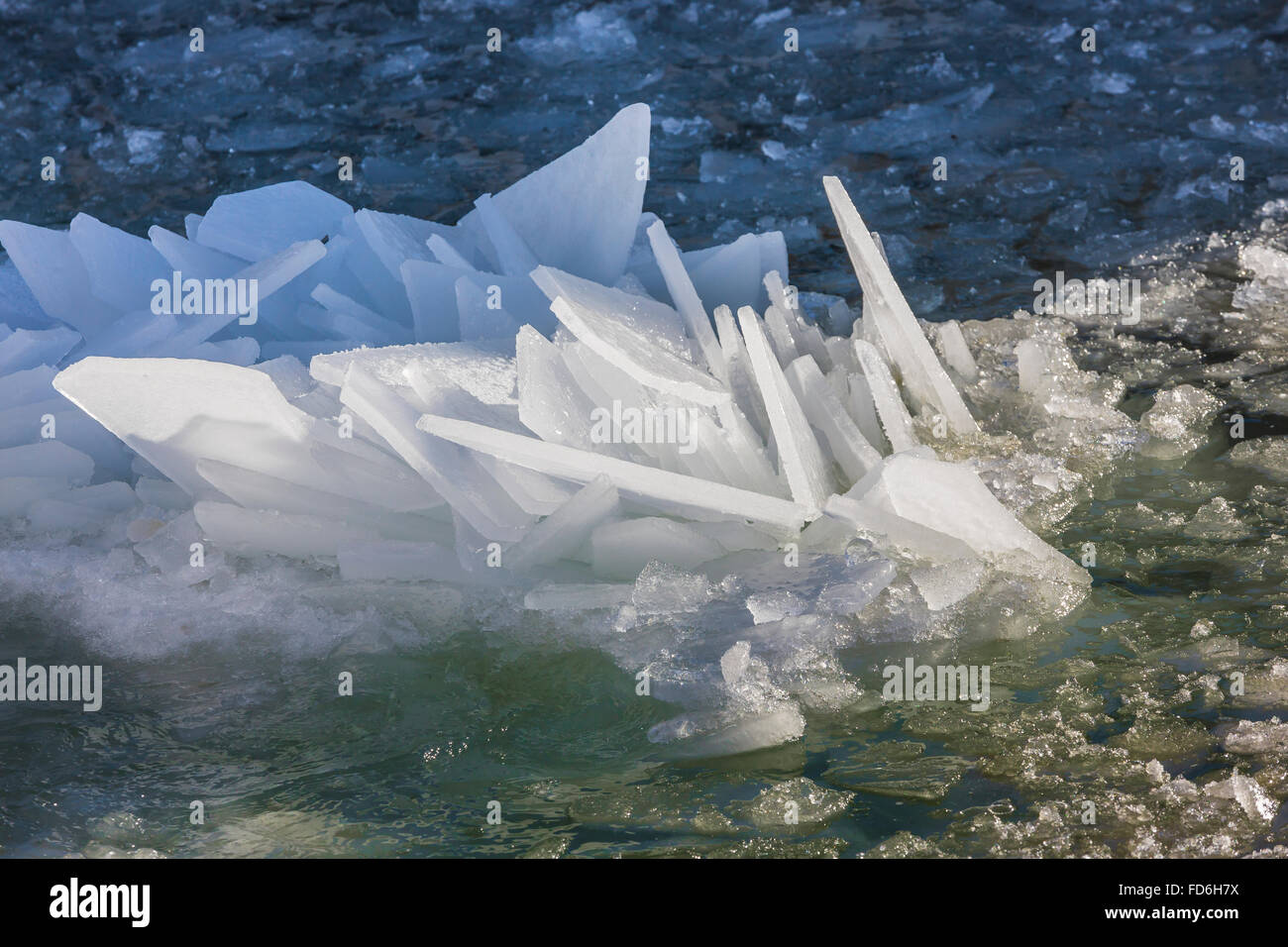 Flat plates of lake ice, broken up by the waves, then refrozen together ...