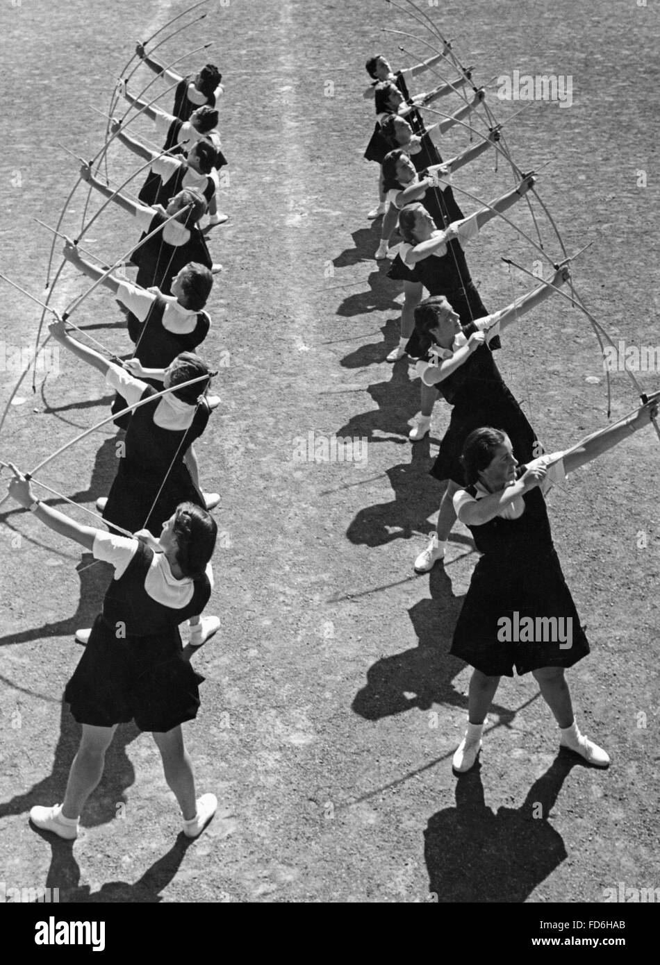 Young women practicing archery in Italy, 1930's Stock Photo