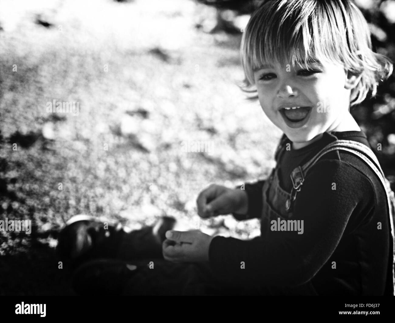 Cute Boy Looking Away While Laughing Stock Photo - Alamy