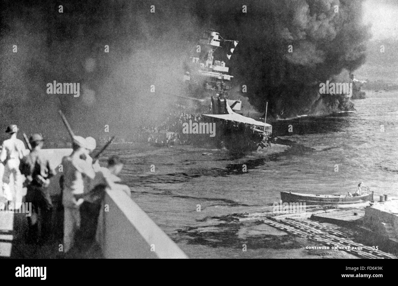 Burning battleship in Pearl Harbor on 12/07/1941 Stock Photo