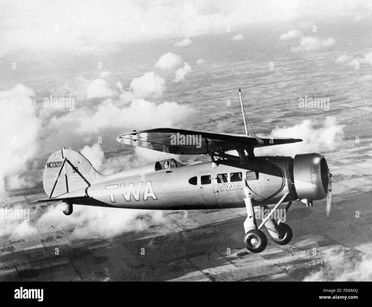Airplane of Transcontinental & Western Airlines in flight, 1932 Stock Photo  - Alamy