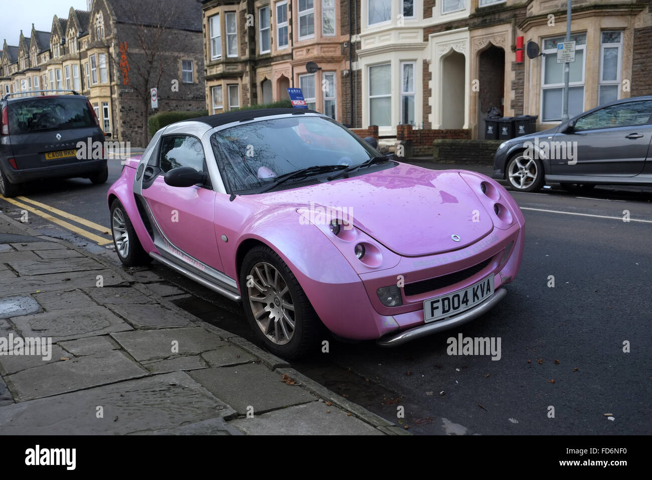 Bright purple smart sports car in the center of Cardiff, January 2016 Stock Photo