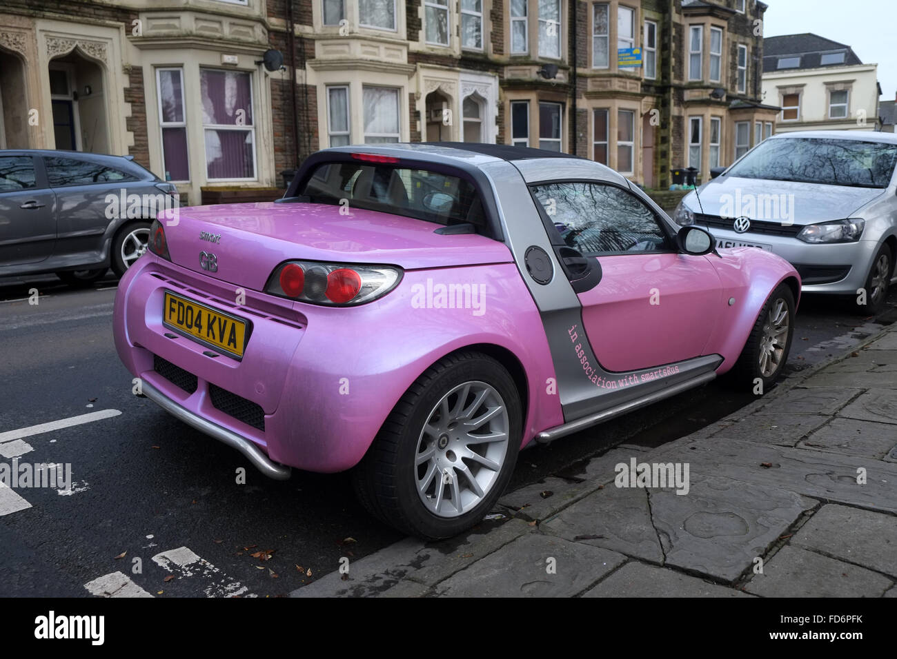 Bright purple smart sports car in the center of Cardiff, January 2016 Stock Photo