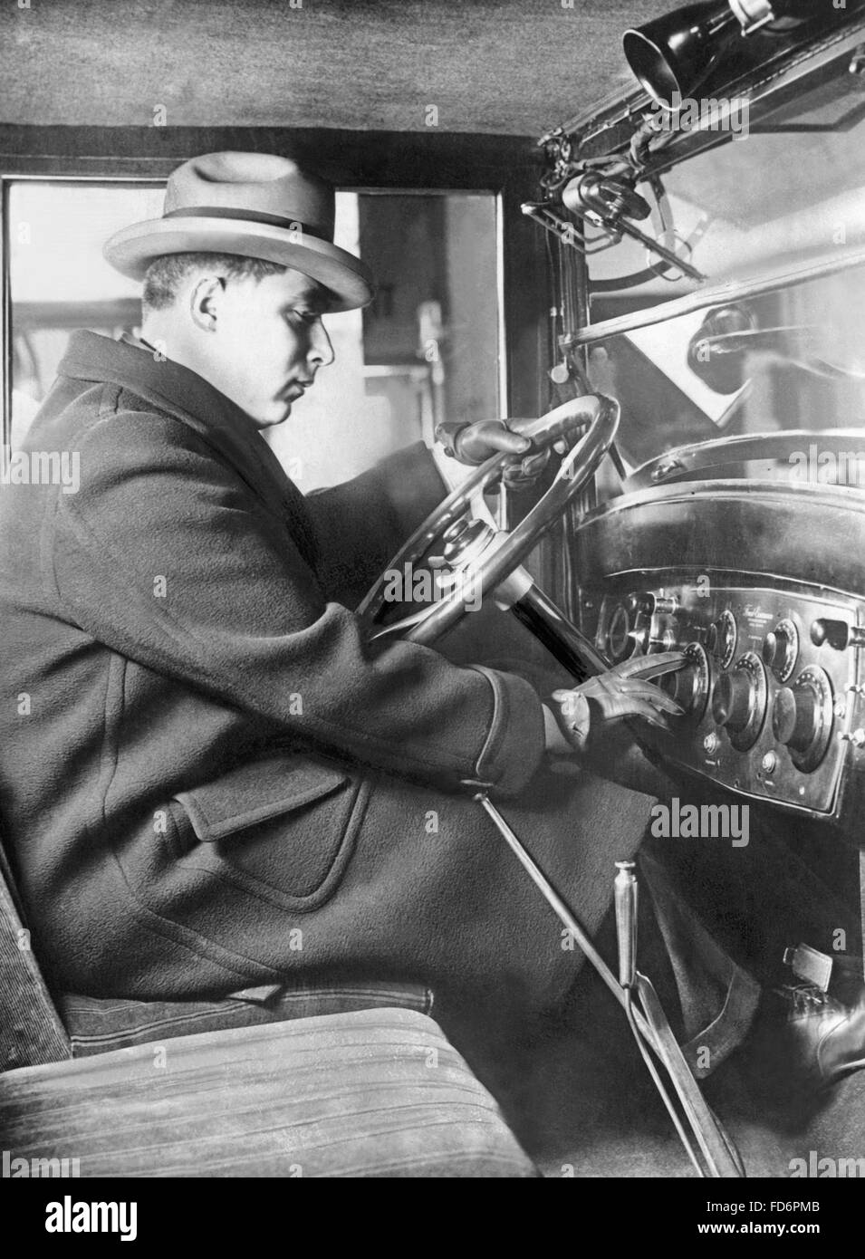 Man sitting inside of a Chevrolet Sedan, 1925 Stock Photo