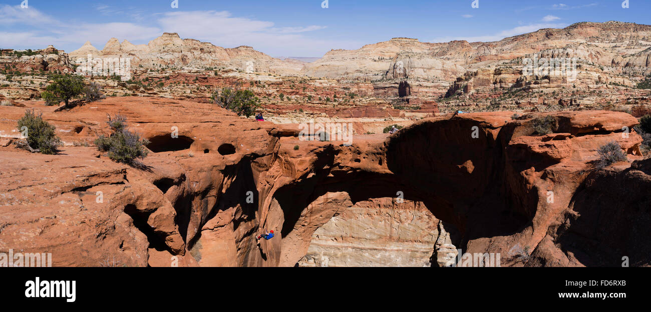 Climber and spectators - Scene from Cassidy Arch, Capitol Reef National Park, Utah. Stock Photo