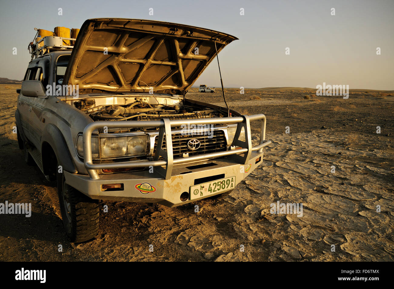Toyota Land Cruiser with open hood in the Danakil desert, Afar Region