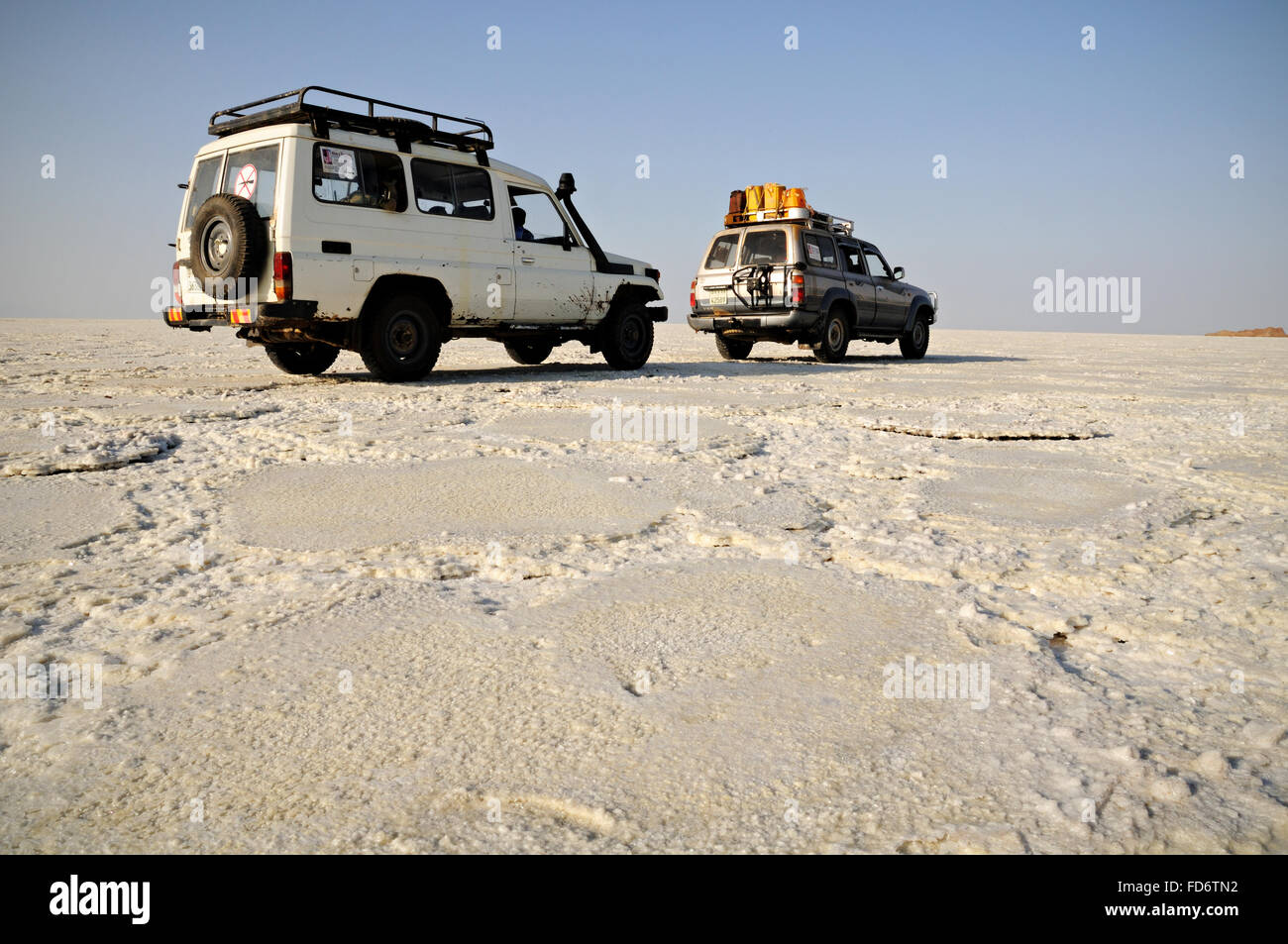 Two Toyota off-road vehicles on Lake Assale in the Danakil depression, Afar Region, Ethiopia Stock Photo