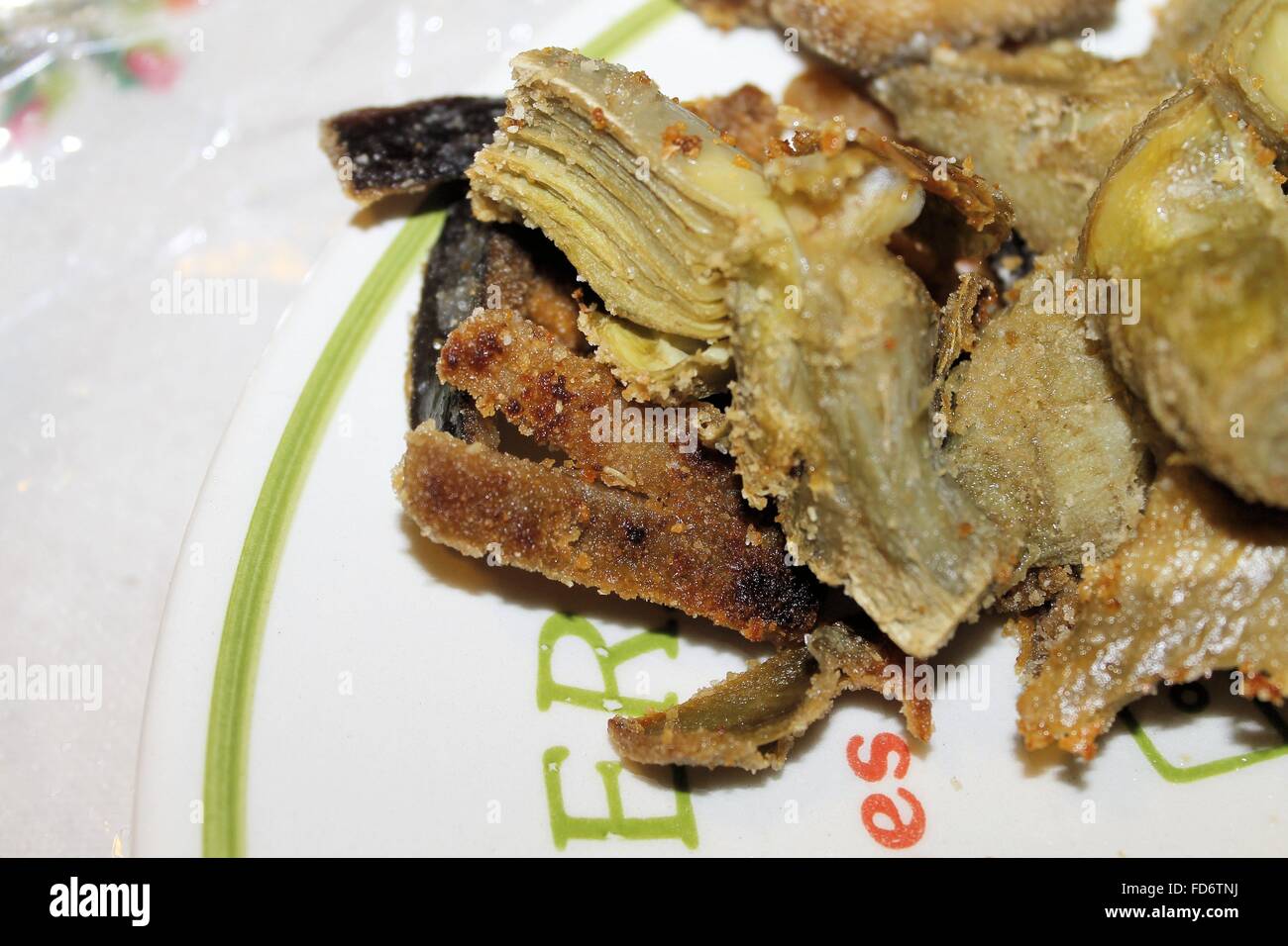 artichoke hearts au gratin in the plate Stock Photo Alamy