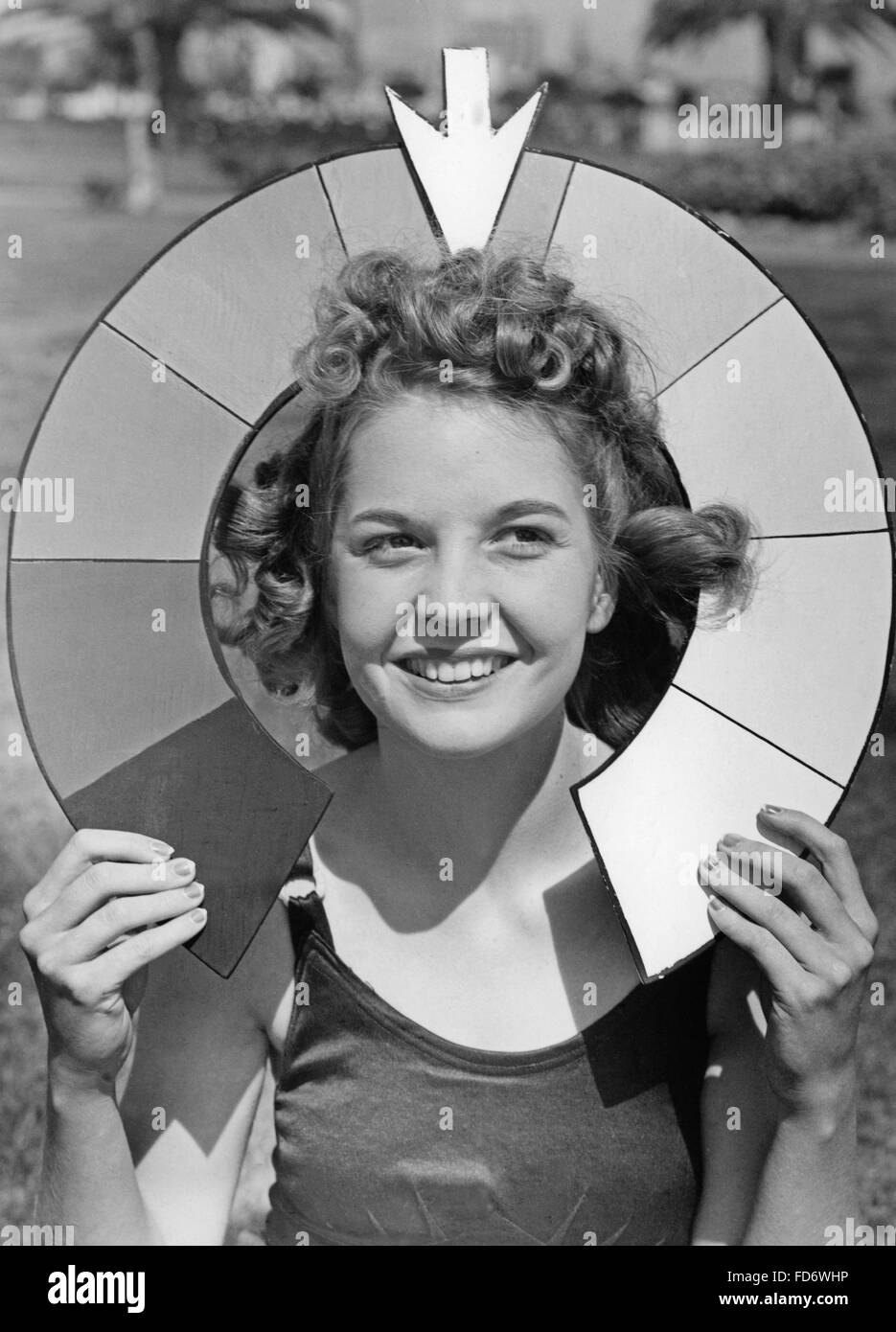 Woman with a 'blond meter', 1938 Stock Photo