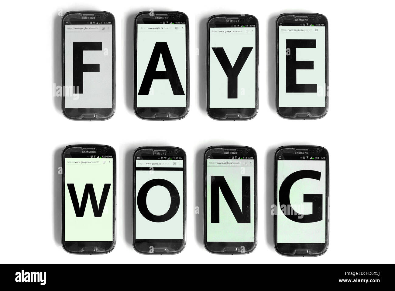The name of Weibo star Faye Wong spelled out on the screens of smartphones photographed against a white back ground. Stock Photo